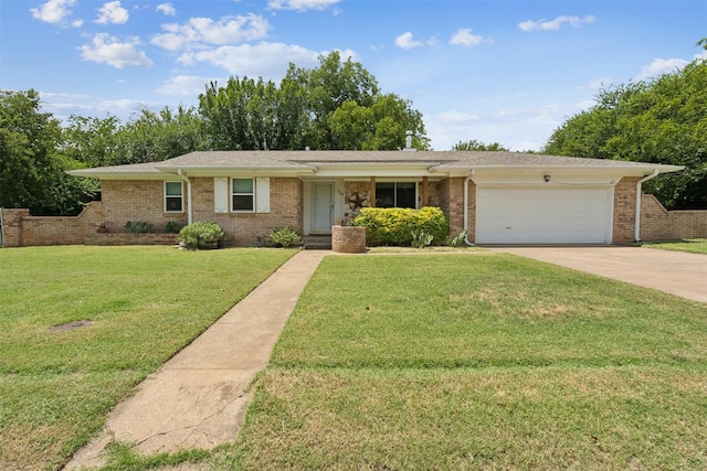 single story home with a garage and a front lawn