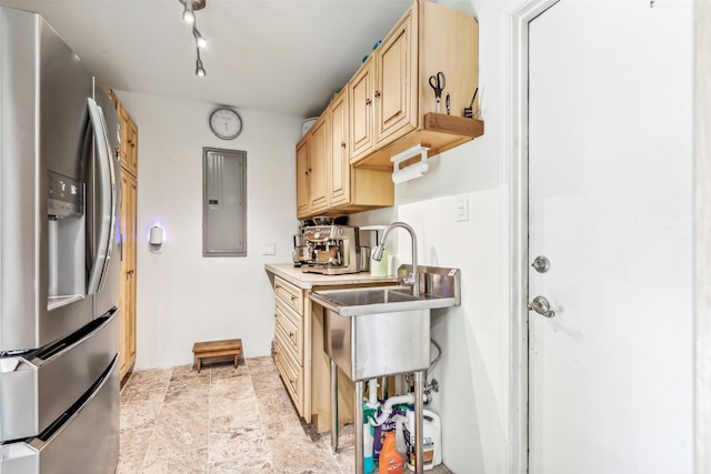 kitchen with light brown cabinetry, stainless steel fridge with ice dispenser, electric panel, light tile patterned floors, and track lighting