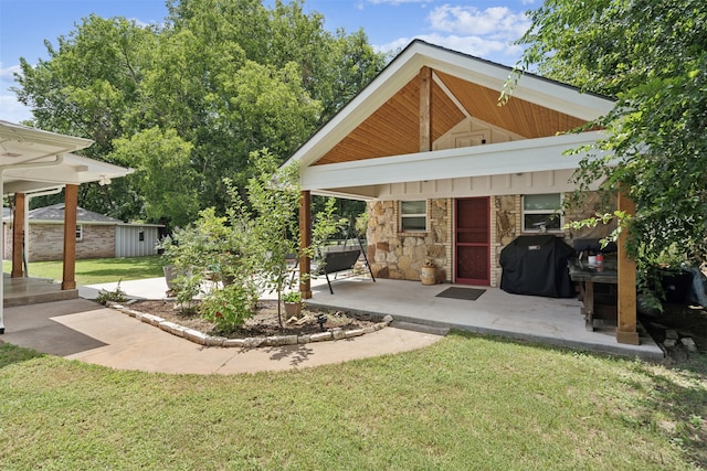 exterior space with a yard and a patio area