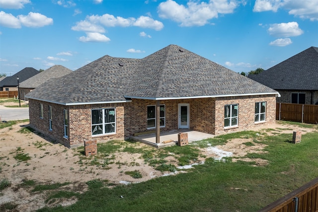 back of property with a patio