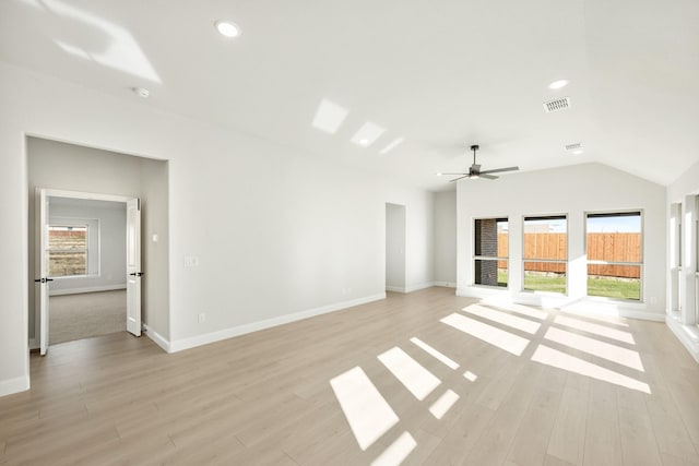 unfurnished living room with vaulted ceiling, light hardwood / wood-style flooring, and ceiling fan