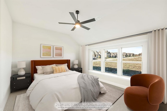 carpeted bedroom featuring ceiling fan and lofted ceiling