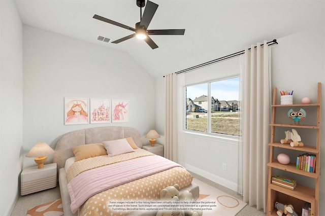 bedroom featuring light carpet, vaulted ceiling, and ceiling fan