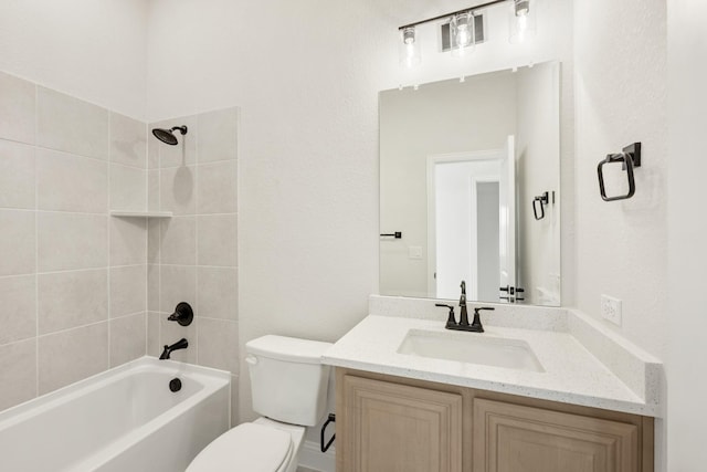 full bathroom featuring tiled shower / bath combo, toilet, and vanity