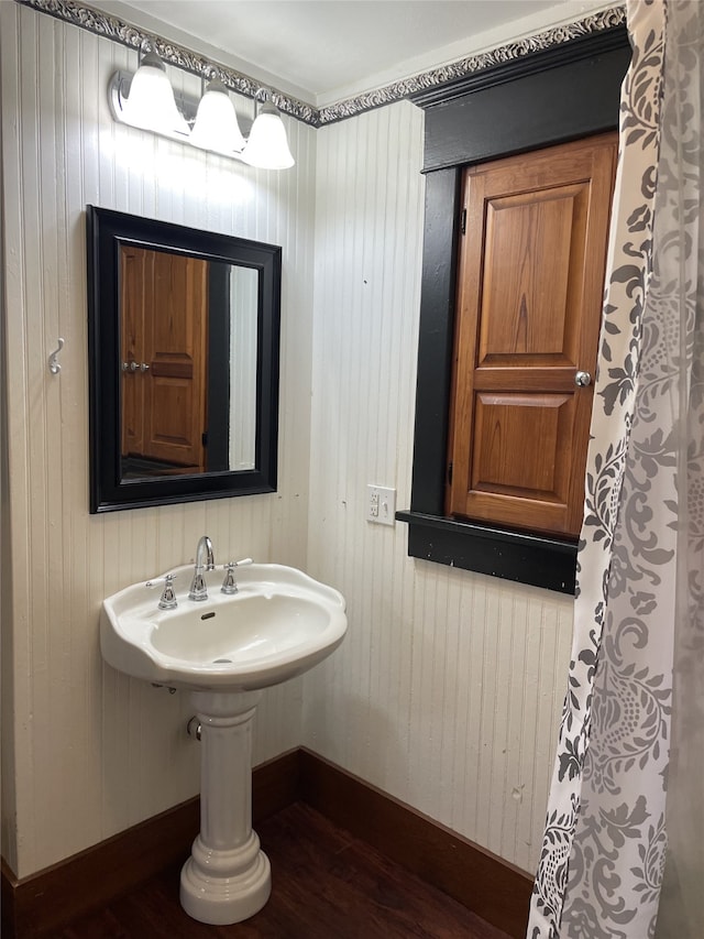 bathroom with hardwood / wood-style floors