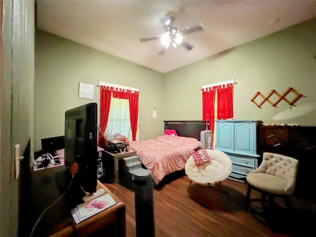 bedroom with hardwood / wood-style floors and ceiling fan