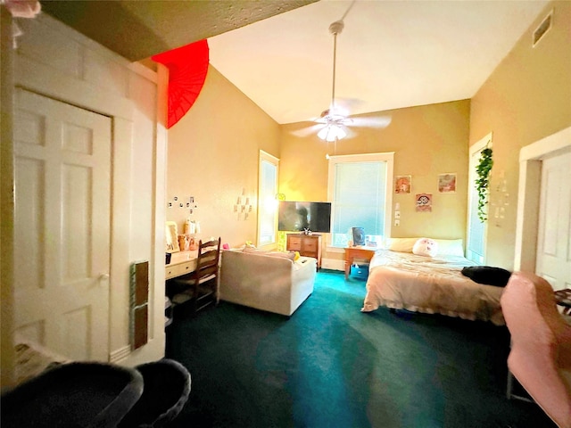 bedroom featuring ceiling fan, lofted ceiling, and dark carpet