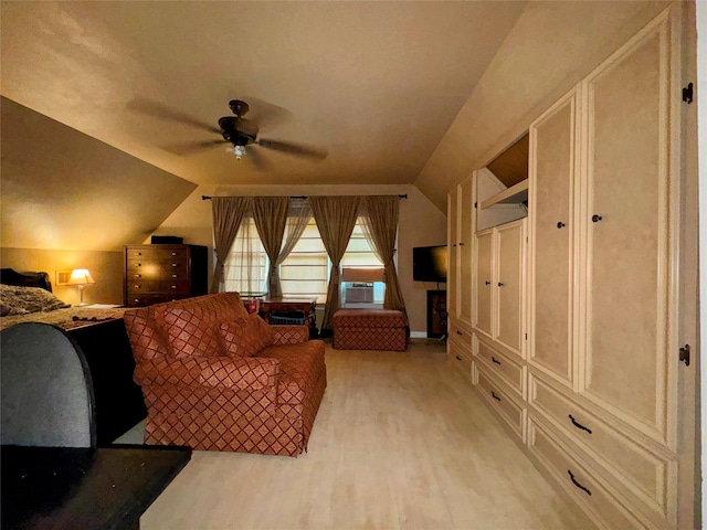 interior space featuring cooling unit, ceiling fan, lofted ceiling, and light hardwood / wood-style flooring