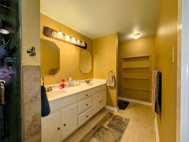 bathroom with vanity and hardwood / wood-style floors