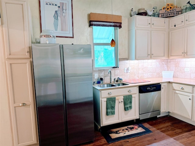 kitchen featuring sink, white cabinetry, backsplash, stainless steel appliances, and dark hardwood / wood-style flooring