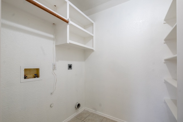 laundry area featuring hookup for a washing machine, electric dryer hookup, and light tile patterned floors