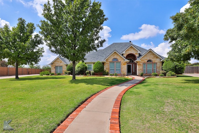 single story home with a front yard