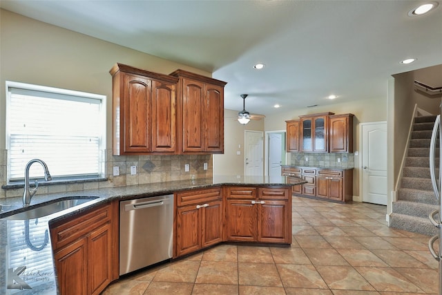 kitchen featuring dishwasher, tasteful backsplash, sink, ceiling fan, and light tile patterned floors