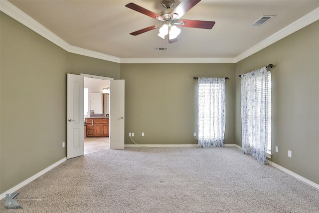 empty room with ceiling fan, light colored carpet, and ornamental molding