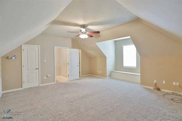 bonus room featuring light carpet, ceiling fan, and lofted ceiling