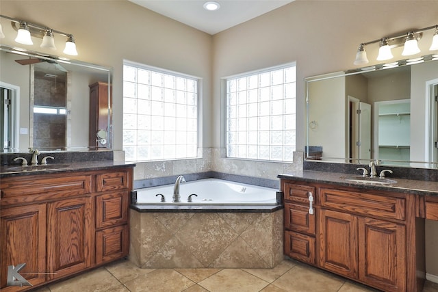 bathroom with vanity, plenty of natural light, and tile patterned floors