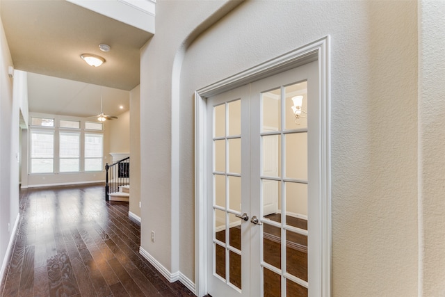 hall featuring wood-type flooring and french doors