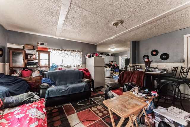 living room with a textured ceiling