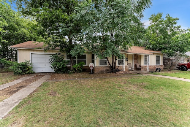 view of front of house with a porch, a garage, and a front yard