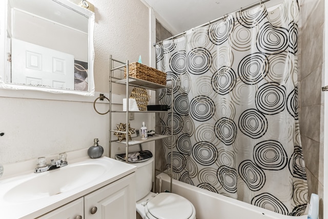 full bathroom with shower / tub combo, toilet, and vanity