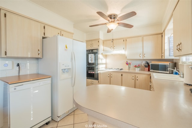 kitchen with light brown cabinetry, ceiling fan, decorative backsplash, white appliances, and light tile patterned floors