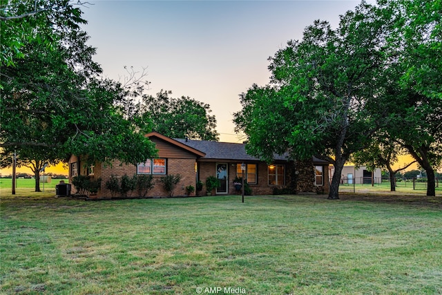 ranch-style house with a yard