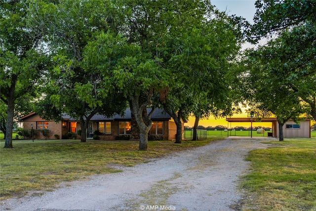 view of front of property with a yard