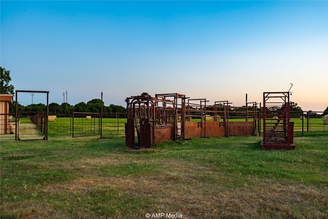 playground at dusk featuring a yard