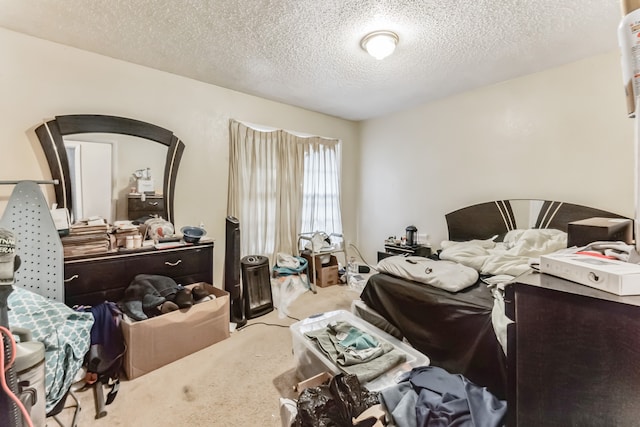 carpeted bedroom with a textured ceiling