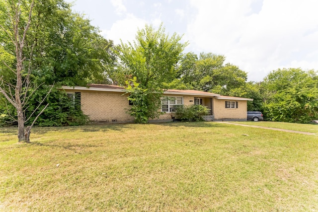 ranch-style house with a front yard