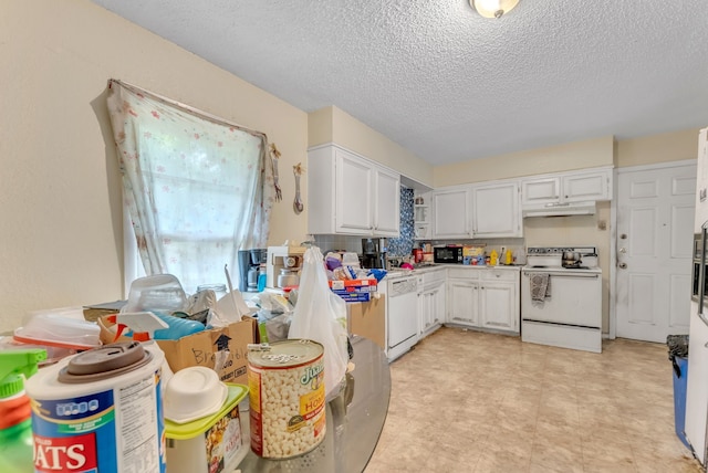 kitchen featuring white appliances, white cabinets, backsplash, light tile patterned floors, and a textured ceiling