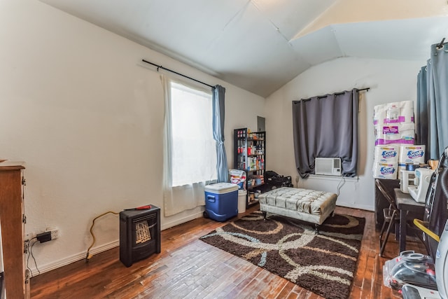 bedroom featuring hardwood / wood-style flooring, lofted ceiling, and cooling unit