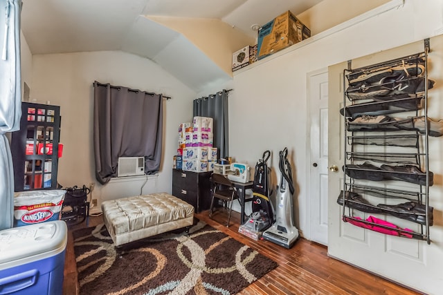 sitting room featuring vaulted ceiling, hardwood / wood-style floors, and cooling unit