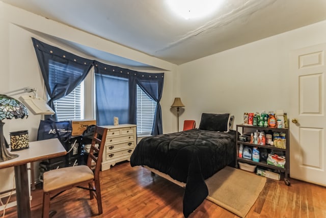 bedroom featuring hardwood / wood-style floors