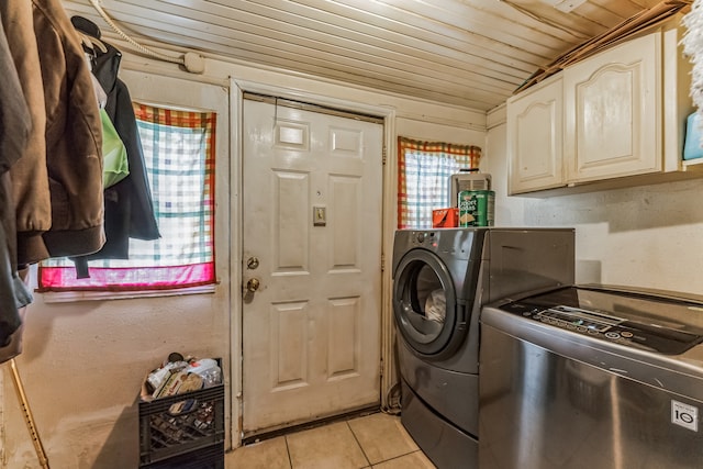 washroom with separate washer and dryer, cabinets, light tile patterned floors, and wood ceiling