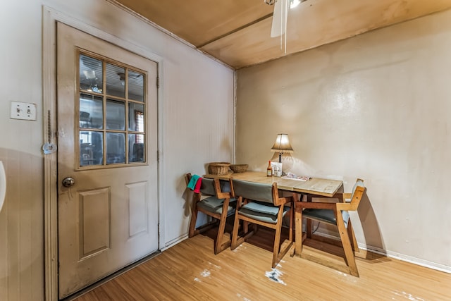 dining space featuring light wood-type flooring and ceiling fan