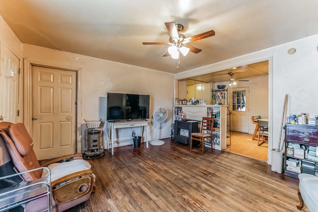 living room featuring hardwood / wood-style floors and ceiling fan