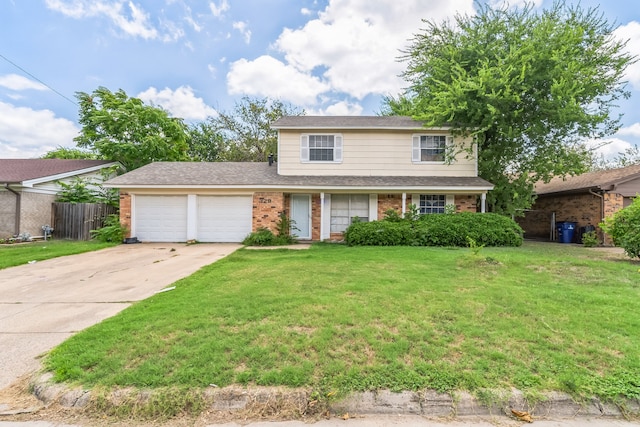 view of front of house featuring a front yard and a garage