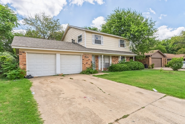 front of property with a front yard and a garage