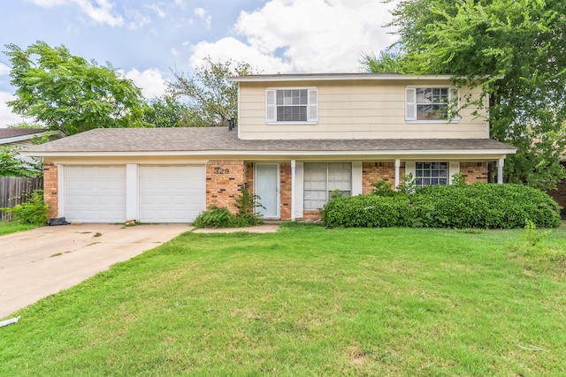 front of property featuring a front yard and a garage