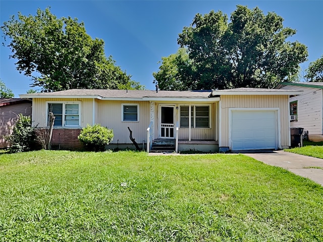 ranch-style house with a garage and a front yard