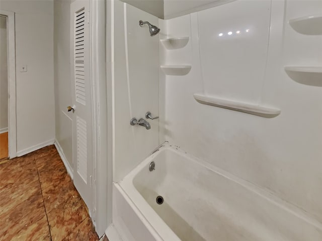 bathroom with tile patterned floors and tub / shower combination