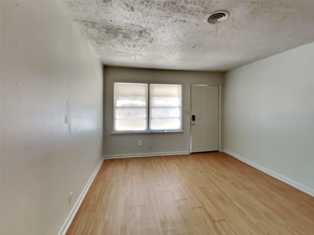 empty room featuring light hardwood / wood-style floors