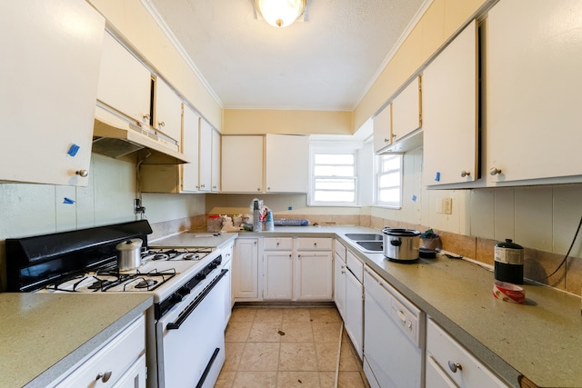 kitchen with white appliances, ornamental molding, and white cabinets