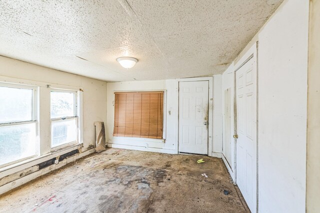 unfurnished bedroom with a textured ceiling