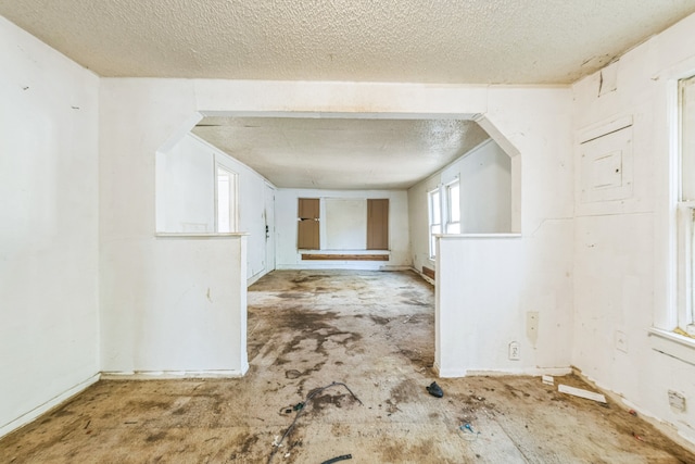 interior space with a textured ceiling