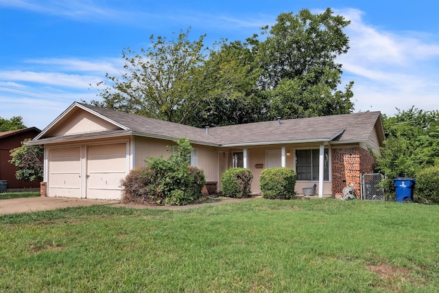 ranch-style house with a garage and a front lawn