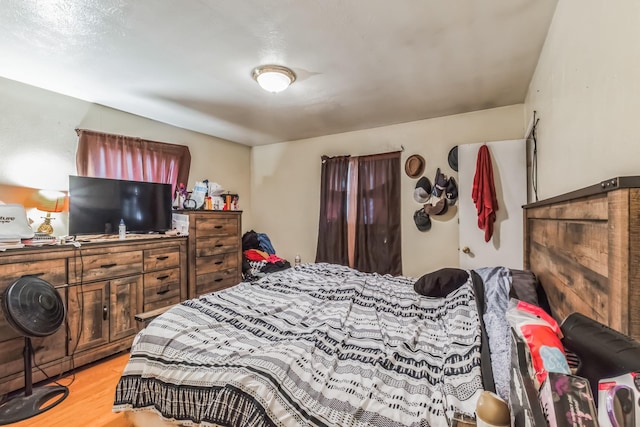 bedroom with light wood-style floors