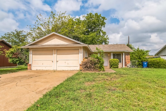 ranch-style house featuring a garage and a front lawn