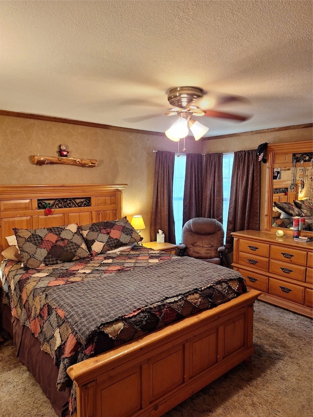 bedroom with ceiling fan, ornamental molding, dark carpet, and a textured ceiling